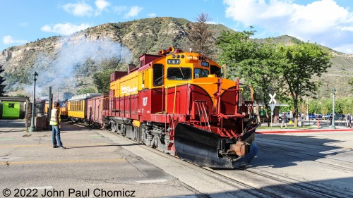 Now, it's time to leave as the 8:15am diesel train crosses West College Drive just outside the Durango Depot. Due to the lack of crossing gates, a flag man is present to stop vehicular and pedestrian traffic.