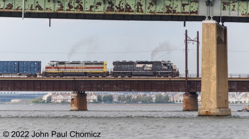 Now nearing the Bayonne side of the bridge, the EL unit and #: 1702 will pull the cars about a half a mile further before clearing the switch and being able to shove the cars back into Oak Island Yard.