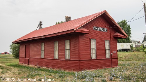 The trackside view of the CB&Q Railroad Skidmore Depot that was built in 1908 to replace the original depot that burned down that year. The Depot provided passenger service for the city of Skidmore, MO until 1955 when the service was discontinued. The rail line saw freight service up until 1977 when that was ended, as well. The Depot is now in the process of becoming a museum and, although this picture was taken in the summer of 2012, I don't know if this has happened yet.