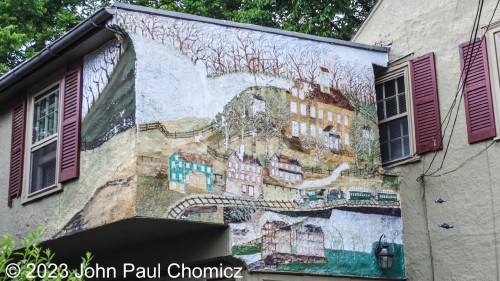 This weathered but cute-looking mural adorns the house at 75 West Ferry Street in New Hope, PA. Not my artwork, of course.