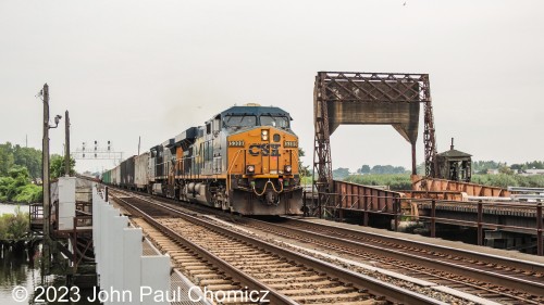 The #: 5309 and its partner cross Overpeck Creek for the fifth and final time of the afternoon. After adding the garbage gons to the rest of its mixed freight train and waiting for the southbound ballast and northbound stackpack, it finally heads northbound to Selkirk. This would be the last good photo I took of this day. The B&O unit would come by but well after dark, around 11:00pm. I took a still photo but don't think it's worth posting. Funny, after arriving way late, it actually led the northbound counterpart on-time the following morning. It turns out, track-work wasn't the culprit for the delay. It was a derailment that occurred in Amsterdam, NY the previous day.