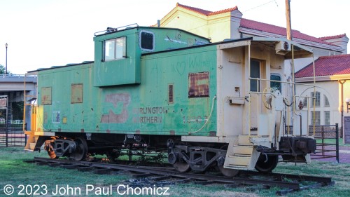 Burlington Northern #: 12097 is on display between the depot and freight house in Chickasha, OK. I couldn't find much information about it but it seems to have been purchased new in September 1975.