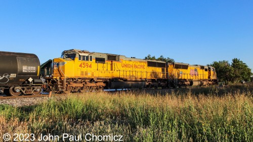 A few minutes later, I got to the railroad crossing just in time to see the lead units of another UP mixed-freight as they crossed East Chestnut Street in Enid, OK.