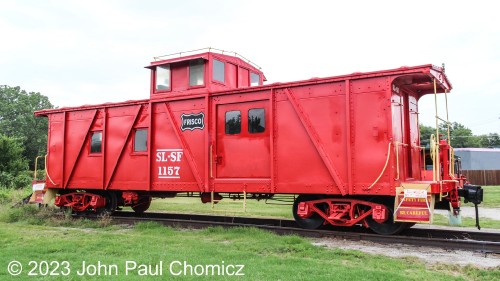 The Frisco #: 1157 is one of the other items on display at the Historic Route 66 Village in Tulsa, OK. It was built by the Frisco, as a boxcar, in 1938 but was converted to a caboose in 1952 with the addition of the cupola. The caboose was restored to its original working condition and has retained the sliding doors, on its side, from when it was a boxcar.