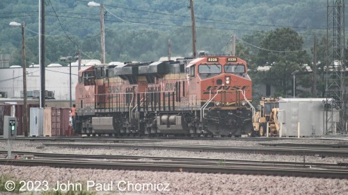 These two units were doing work in the BNSF Cherokee Yard on a very dimsal/rainy day in Tulsa, OK.