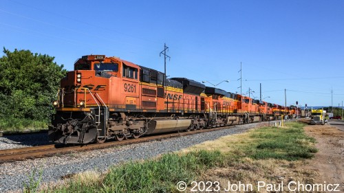 Immediately after the southbound loaded hopper train cleared, this northbound empty hopper train departed the fuel pad in Heavener Yard and began its journey north......With more pumpkins in the lead!!! I don't know if these are helper units from a previous southbound and are coupled up to the front of a northbound to be sent back to their point of origin but this train had eight units up front. There were some Belles and a CP unit buried all the way in the back.