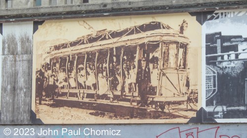 The photo is mine, but the mural was made by local artists. This mural is of Streetcar #: 23 in its original open-air state and number #: 3 as it plied the streets of Nelson. this mural adorns a retaining wall, near the corner of Vernon and Kootenay Streets in Nelson, British Columbia, Canada.