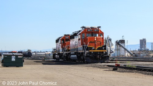 Two remote control-powered BNSF SD40-2's #: 1677 and #: 1734, pause for a moment in front of the Yardley Yard office in Spokane, WA.