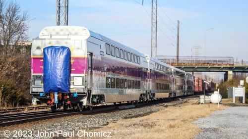 Another photo, from the better lit angle, show that these are new MBTA Multilevels bound for the Boston, "T", to replace the current single-level cars.