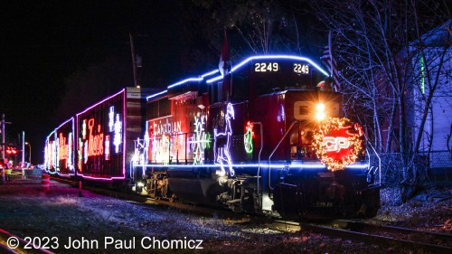 The next photos may seem like repeats but one of the things about the Holiday Train is that its lights change colors. I wanted photograph the train in as many colors as possible. Here, it is in blue.