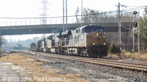 A CSX M-Train pulls out the east end of the ex-B&O Wilsmere Yard in Wilmington, DE. It will then shove back into the yard to pick up the string of cars on the left in this photo before heading north towards Selkirk, maybe?