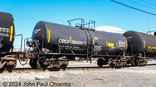 This tank car may have been put in the dryer for too long. It seems to have shrunk. Whatever the case, I really like finding these little abnormalities in the consists of trains. It's pretty neat.