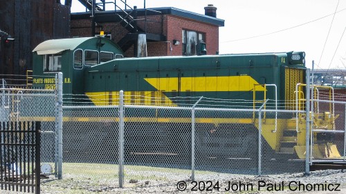 This was another photo that I wasn't sure I wanted to post. It's not the greatest photo because I really dislike getting photos of equipment hidden by fences and such. Nonetheless, now that this operation is probably going the way of the Dodo, I think it's more post-worthy. Here is the Flats Industrial Railroad #: 1202 as it sits barricaded in the railroad's small yard in the Flats section of Cleveland, OH. It's an SW1200 that was the second unit purchased by this railroad. This photo was taken in 2007 and the unit has since been sold to the Davenport Industrial Railroad in Davenport, Iowa.