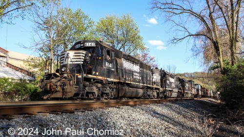 At the west end of Allentown Yard, the Yard job pulls a long cut of Epic cars out onto the Lehigh Valley Secondary track alongside Canal Park in Allentown, PA. I don't know if they are coming or going but they were or will be back at Oak Island at some point.