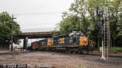 OI-16 stares down the signal for the Port Reading Secondary as the engineer waits for the signal to pull forward across the diamond crossing with the Chemical Coast.