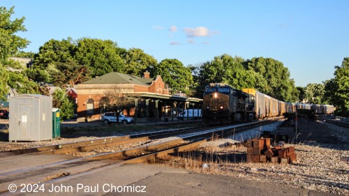 A little mis-timing and the lead unit has now gone into the shadows as the northbound CSX autorack train passes the station in Ridgefield Park, NJ.