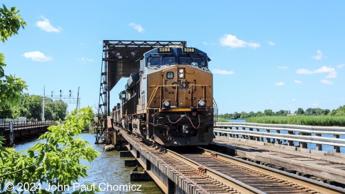 CSX Manifest Train #: M404 crosses Overpeck Creek after picking up cars from the NYS&W Little Ferry Yard in Ridgefield, NJ.