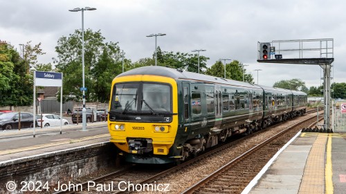 Great Western Railway also operates out of Salisbury Station. Here, an eastbound British Rail Class 166 Networker Turbo MU set is arriving from points west.