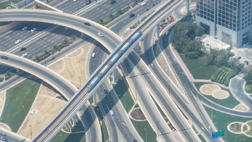 A zoomed-in view of the metro from the Burj Khalifa. It is a fully automated system without any operators. Although there is the metro, trams, and buses, Dubai is not a very pedestrian friendly city and is more automobile focused. This is the extent of railfanning in the UAE as there are no freight trains and railfanning, in general, is frowned upon over there.