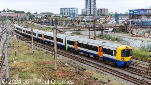 In addition to the London Underground, which is mostly subway, there is the London Overground which is an elevated train. Here, an eastbound British Rail Class 376 Electrostar MU set passes through Willesden Junction. This is an extremely complex junction with a lot of action passing on each track and in each direction.