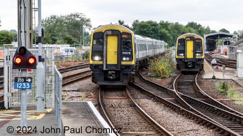 It appears that these two South Western Railway trains are racing each other. On the left, my train arrives at Salisbury Station. It will take me east back to Waterloo Station. On the right, another train set has just been re-crewed at the maintenance station and heads east out of the service track and back towards the main.