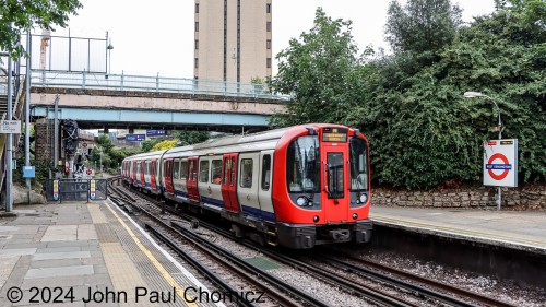 Although it is above ground, at this point, this London Underground or, "The Tube", train arrives at West Kensington Station on the District Line.