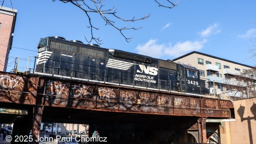 On this morning, an outing for something else, led me to catch the other Bayonne local at work. Here, the NS SD40-2  #: 3429 is the lead of two units as it stands out over East 21st Street at the mouth of the Bayonne Yard. At the same time, the other Bayonne local is at work drilling cars in the yard to the left. Not too great of an angle but there are only a few good spots to catch the Bayonne locals.